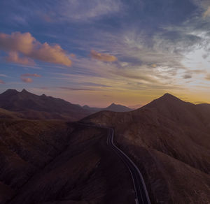 Scenic view of mountains against sky during sunset