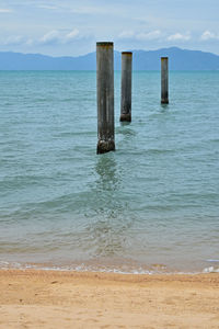 Scenic view of calm sea against cloudy sky