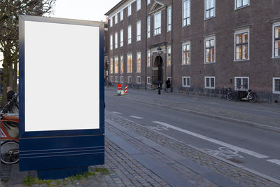 Street by building in city