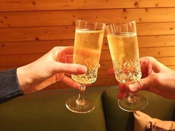 Cropped image of hand holding beer glass