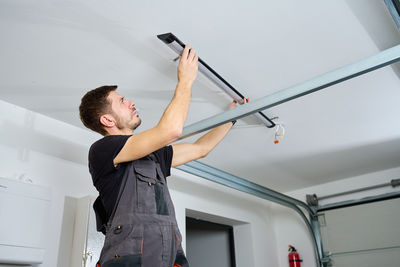 Young man exercising in gym