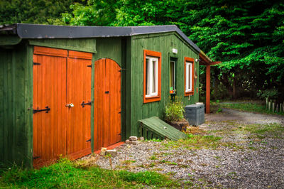 Green color house on field