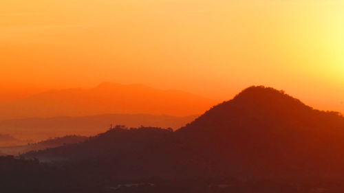 Scenic view of mountains at sunset