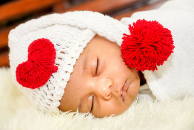 Portrait of cute baby girl with hat