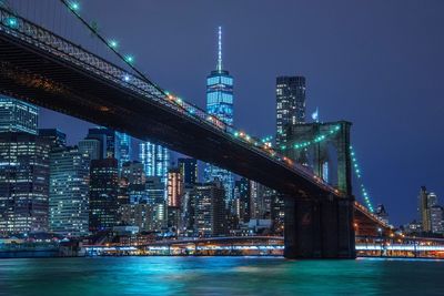 Illuminated city at waterfront