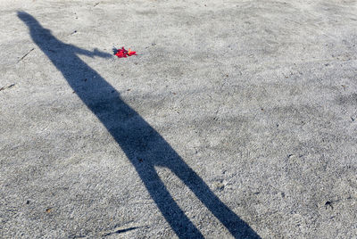 High angle view of person shadow on road