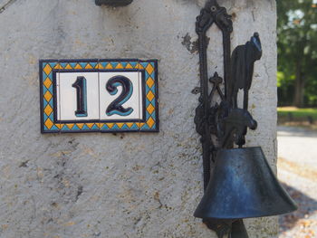 Close-up of clothes hanging on built structure