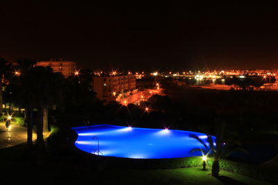 View of boats in sea at night