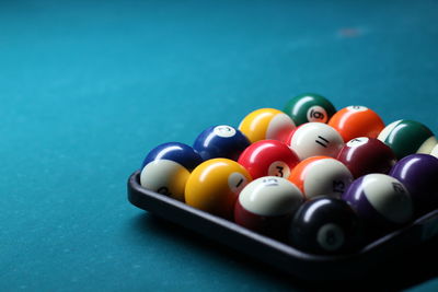 Close-up of colorful balls arranged on pool table