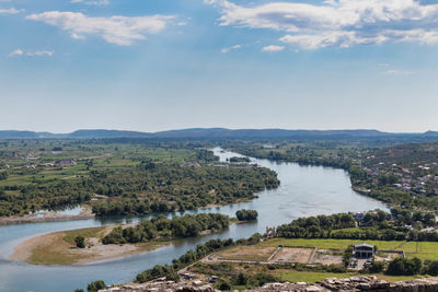 High angle view of river amidst landscape against sky