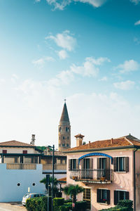 Buildings in city against sky