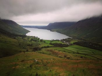 Scenic view of landscape and lake against sky