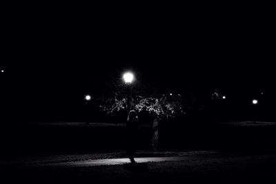 Blurred motion of people in dark room