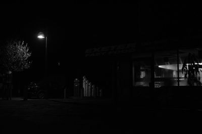 View of illuminated street lights at night