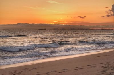 Scenic view of sea at sunset