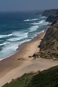 Scenic view of beach and sea at algarve