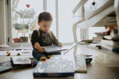 Boy looking at camera at home