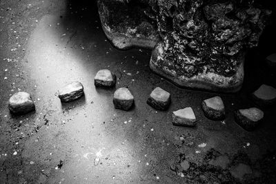 Close-up of pebbles on sand