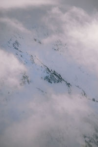 High angle view of snow covered mountain against sky