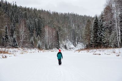 Man skiing on snow covered landscape