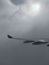 Low angle view of airplane flying in sky