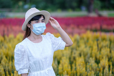 Portrait of girl standing on field