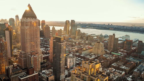 Aerial view of modern buildings against sky during sunset,manhattan, new york city