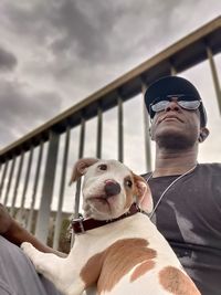 Low angle view of man with dog