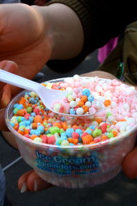 Close-up of hand holding ice cream