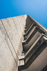 Low angle view of building against clear blue sky