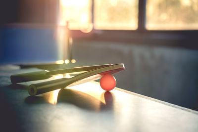 Close-up of table tennis rackets on table