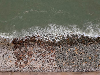 High angle view of stones at beach