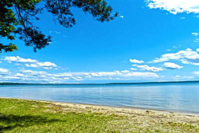 Scenic view of sea against blue sky