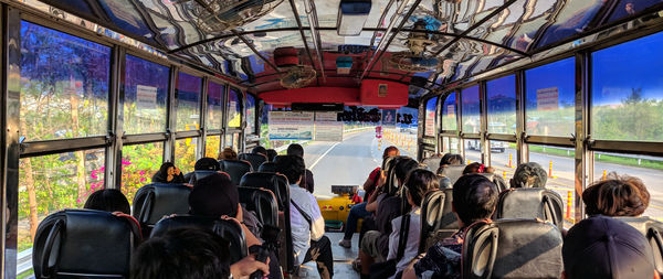 Rear view of people sitting in bus