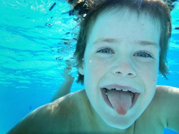 Close-up portrait of child in swimming pool