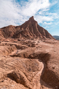 Rock formations in desert against sky