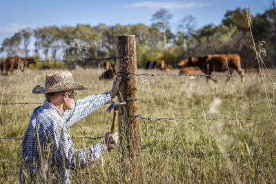 Side view of man working in field