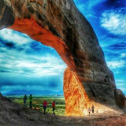 Scenic view of landscape against cloudy sky