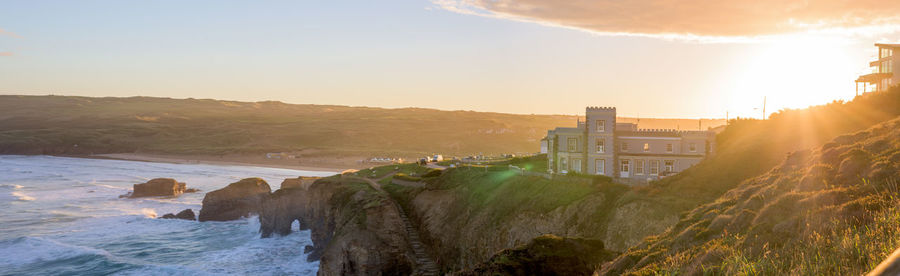 Panoramic shot of sea against sky during sunset