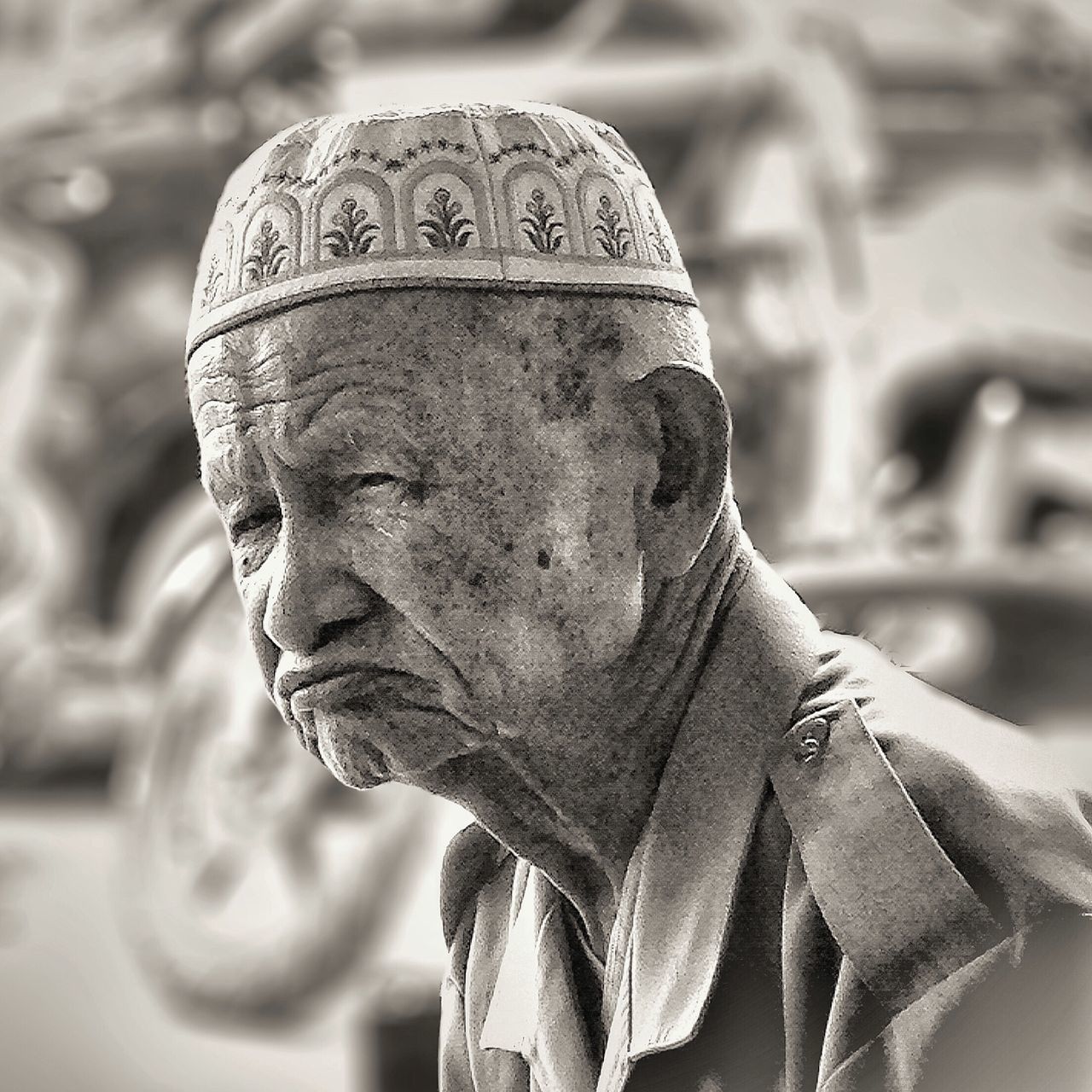 focus on foreground, close-up, human representation, art and craft, sculpture, statue, art, creativity, selective focus, day, carving - craft product, outdoors, old, stone material, no people, detail, text, death, nature