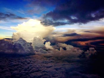 Aerial view of landscape against cloudy sky