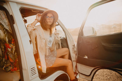 Woman sitting in car