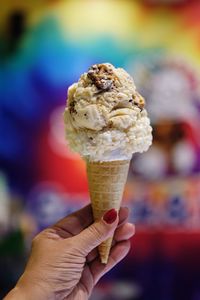 Close-up of hand holding ice cream