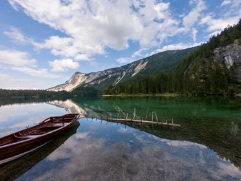 Scenic view of lake and mountains against sky