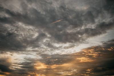 Low angle view of dramatic sky during sunset