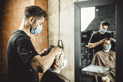 Beautician and hairdresser working with mask for the covid19 virus