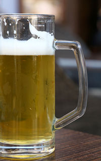 Close-up of draught beer on table