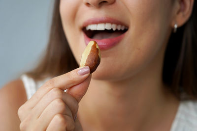 Close-up of woman eating apple