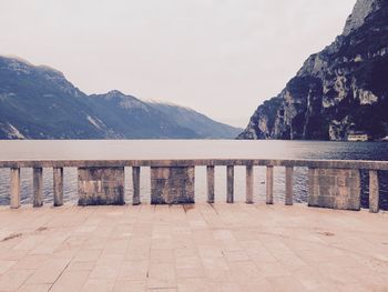 Scenic view of lake and mountains against clear sky