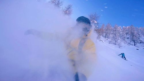 Woman with arms raised in swimming pool